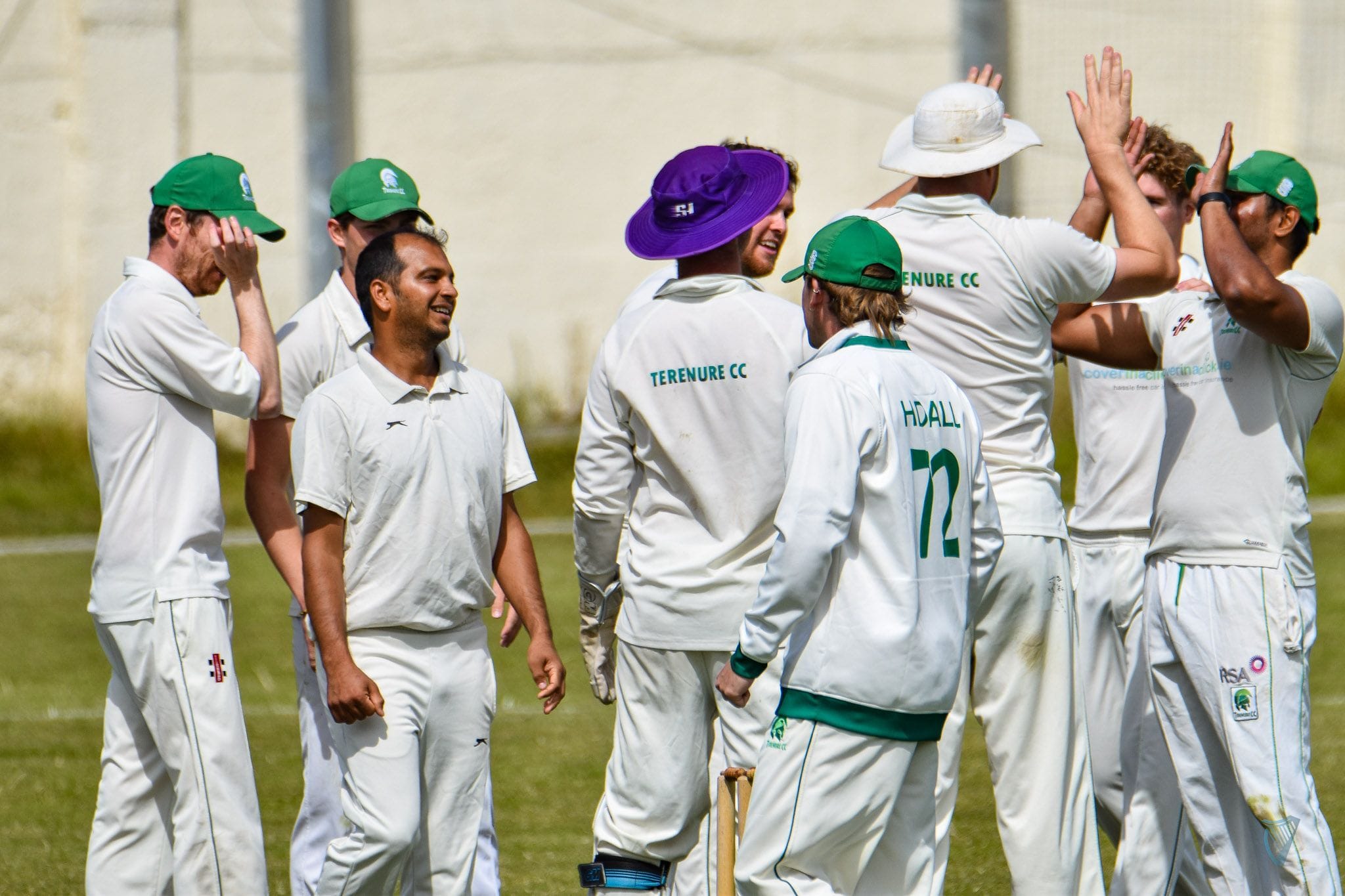 Image of 1st team mens celebrating after a wicket